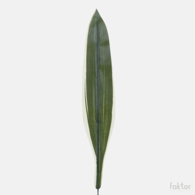 Vihreä-keltainen dracaenan tekokasvin lehti varrella