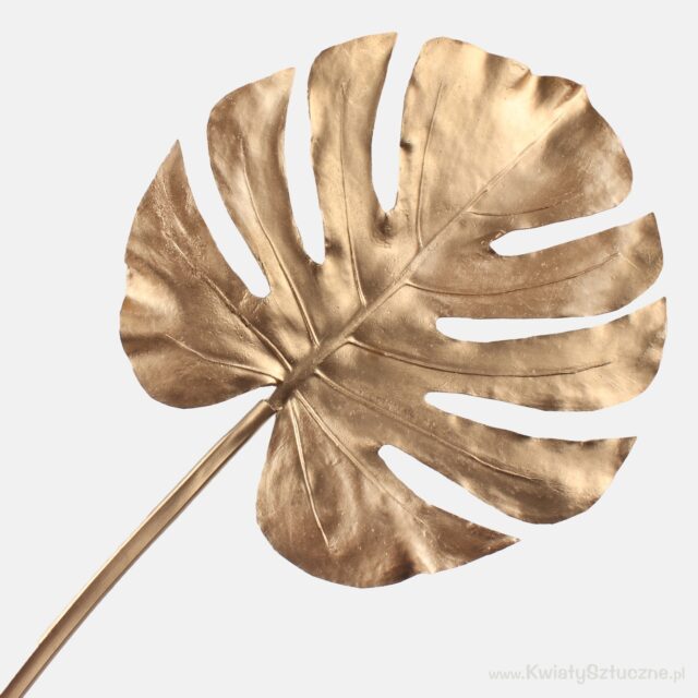 Kultainen metallinen monstera-tekolehti