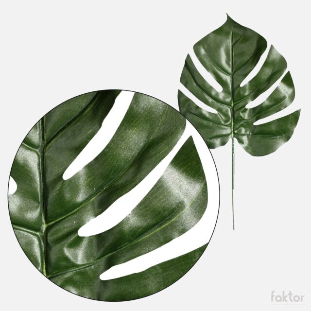 Vihreä monstera-tekolehti varrella