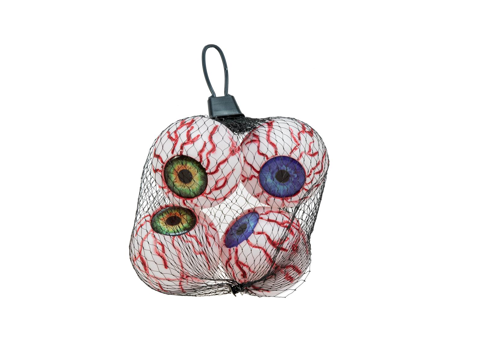Neljä punaisten verisuonikuvioiden koristamaa Halloween-tekosilmää