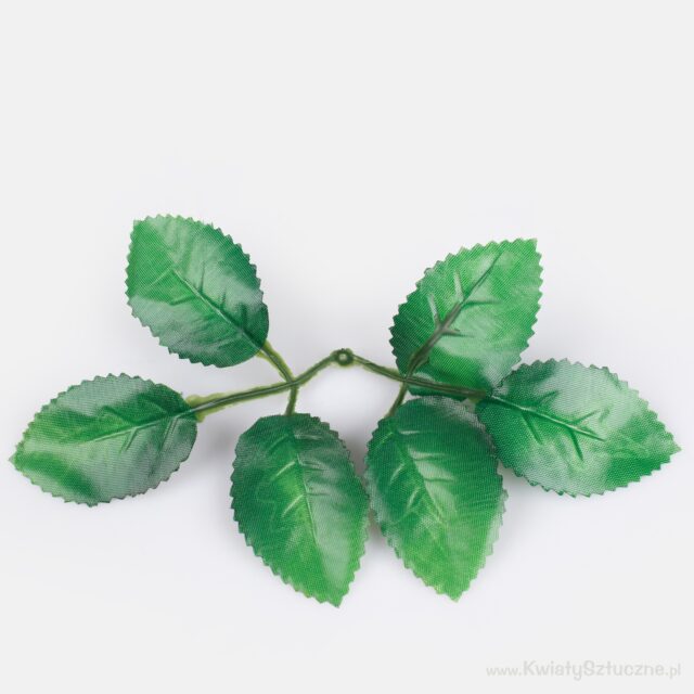 Vihreä tekokukkavarsi ruusunlehdillä
